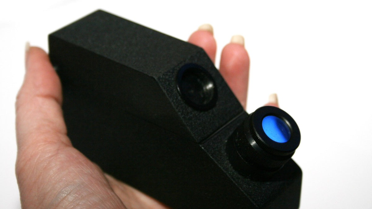 Hand holding a portable refractometer