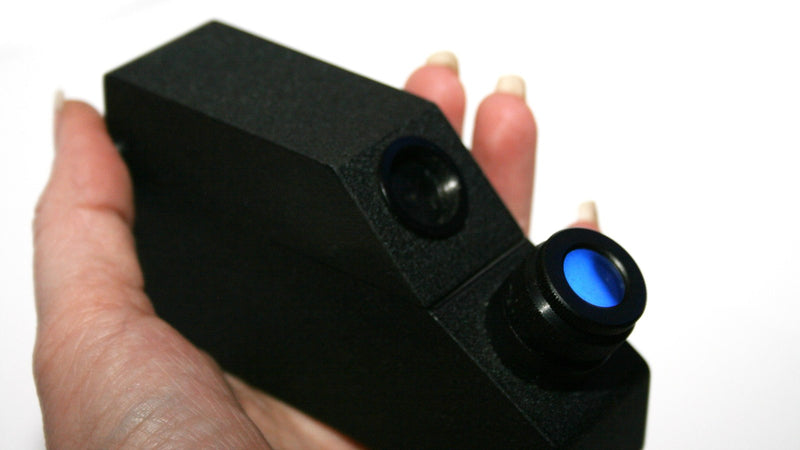 Hand holding a portable refractometer